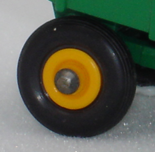 black plastic wheel with yellow plastic hub, 51B John Deere Trailer